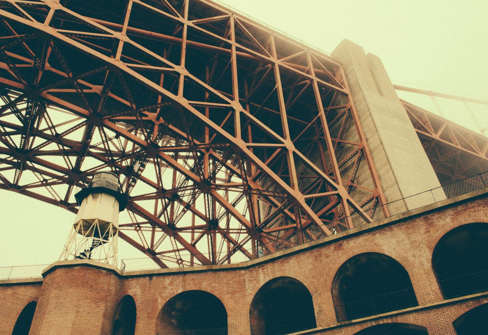 A curved roof edge sweeping over the colonnade